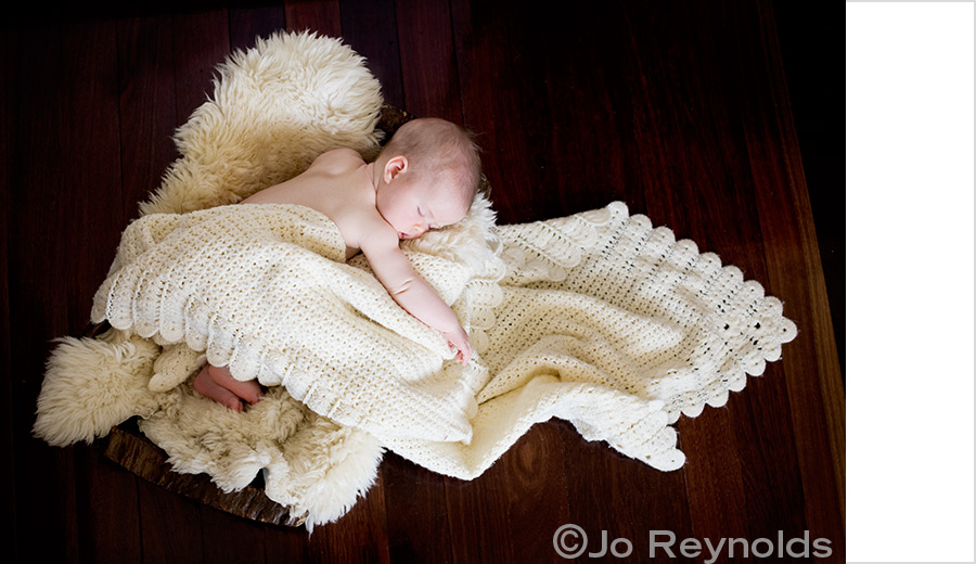 Baby in wooden bowl